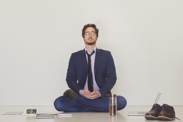 handsome-man-meditating-floor_23-2147791983.jpg