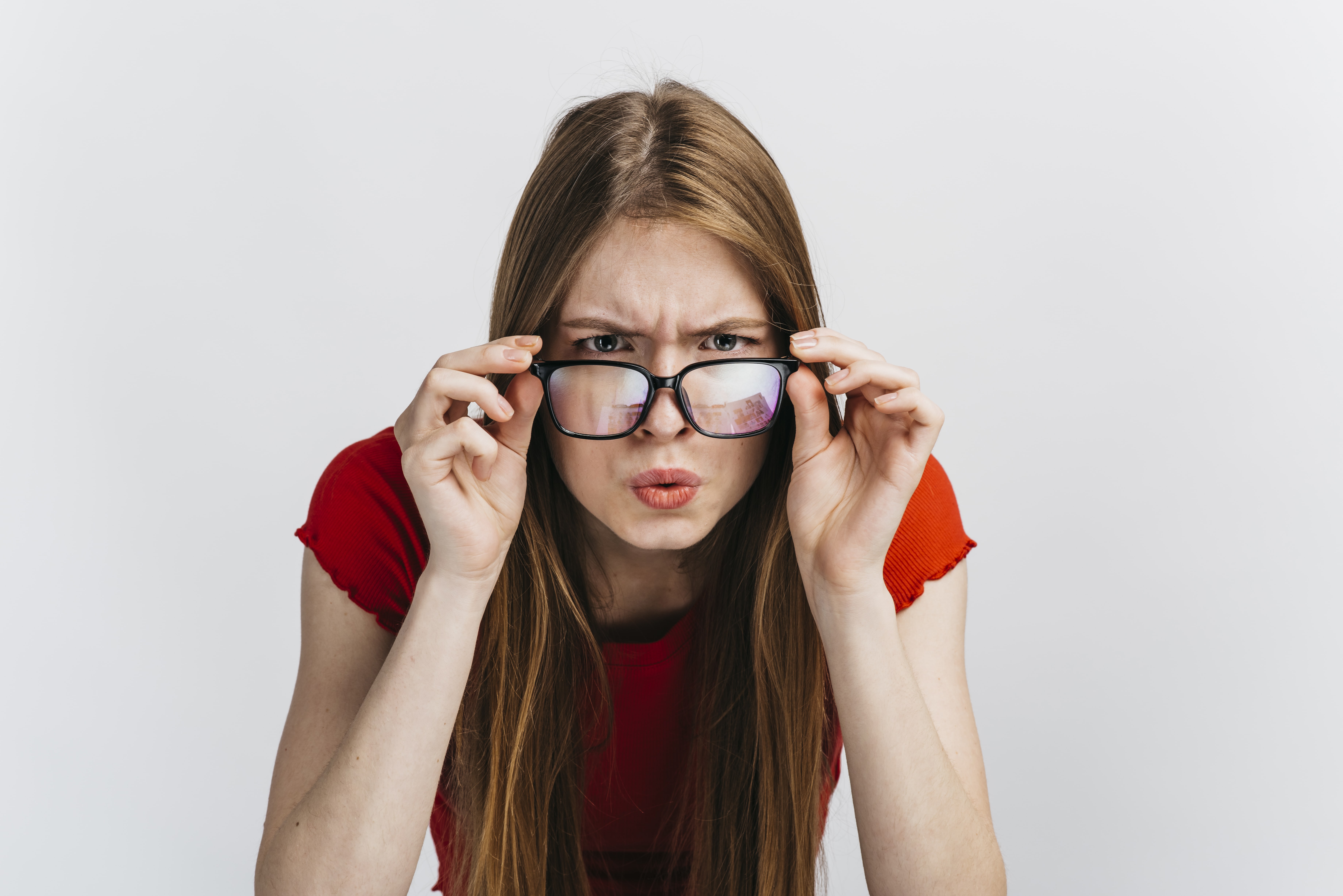curious-woman-with-glasses-staring-min.jpg