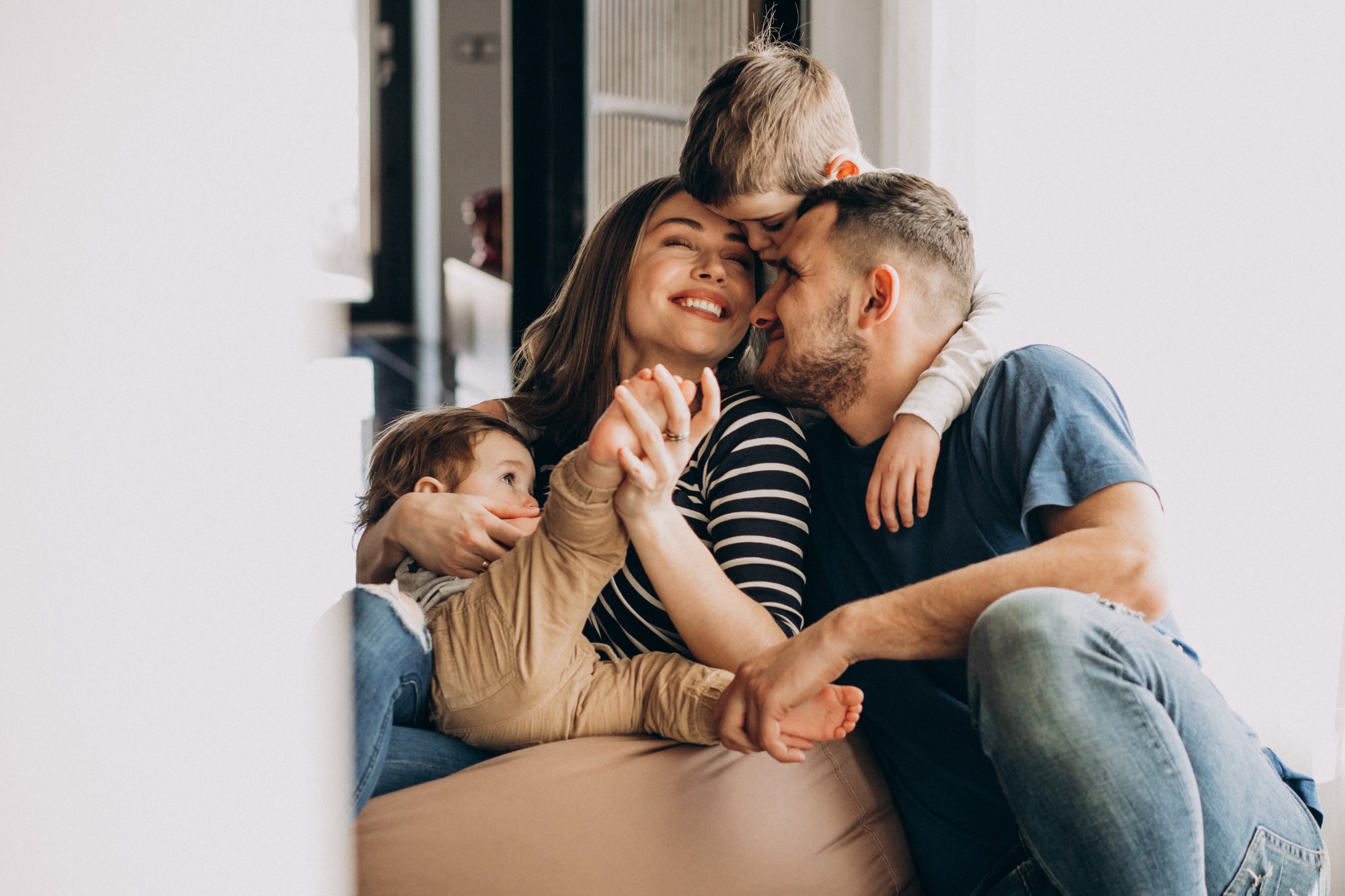 young-family-with-their-sons-home-having-fun-min.jpg